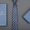 Classic blue striped necktie detail view with elegant matching gift box packaging. - 8cm Dark Blue Yellow Stripe Zipper (Long Gift Box)