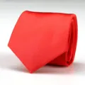 Close-up detail of a bright red men's formal necktie showing fine silky fabric texture. - Bright Red Solid Style