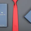 Close-up detail of a vibrant red business tie displayed neatly beside an elegant blue gift box. - 8cm Big Red Solid Zipper (Long Gift Box)
