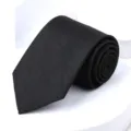 Close up of black geometric pattern tie detail showing fabric texture and fine workmanship - 8cm Black Pattern Self-tie