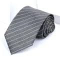 Close-up detail of grey striped necktie fabric texture and fine white line pattern design. - 8cm Grey Stripe Self-tie