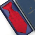 Red jacquard patterned necktie presented in an elegant blue gift box for formal wear. - Hand-Tied / Long Box / Red Floral