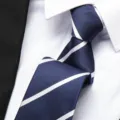 Classic navy blue mens necktie detail featuring elegant white diagonal stripes for formal business wear. - 8cm Blue Stripe Zipper