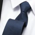 Close-up detail of a classic navy blue men's business necktie with abstract lines pattern. - 8cm Blue Snowflake Zipper