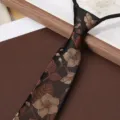 Close-up detail of mens vintage floral zipper tie, black fabric with fine leaf pattern. - Black Autumn Branch 8cm Zipper Tie