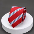 Close-up detail of the classic red striped mens necktie showing fine textured fabric. - Red Background Blue Double Lines