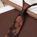 Close-up detail view of men's vintage brown floral jacquard textured zipper tie fabric. - Auspicious Cloud Dream 8cm Zipper Tie