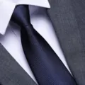 Men dark blue textured necktie detail shot, premium formal business suit tie accessory. - Navy Small Grid Zipper Style / 8cm