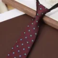 Detailed view of the dark red zipper tie featuring a classic blue geometric square pattern. - Red Rhombus Floral 8cm Zipper Tie