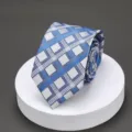 Detailed view of a stylish blue and silver plaid necktie for men, perfect for business formal. - L001 Blue Plaid