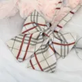 Detailed view of a classic plaid bowknot JK collar ribbon accessory for uniform shirts. - Champagne Plaid Collar Flower