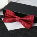 Close-up detail of the elegant red and black striped bow tie, perfect for formal wear. - Classic Fashion Wine Red Bowtie