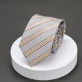 Detail view of a classic blue striped men's necktie with brown pattern, perfect for business work. - L027 Beige Stripe