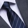 Classic men's blue striped tie paired with a white dress shirt and grey suit for business. - Diamond Blue Stripe Zipper Style / 8cm