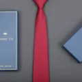 Detail view of a classic red business tie paired with a blue gift box, elegant and stylish. - 8cm H013 Zipper (Long Gift Box)