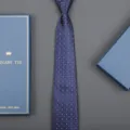 Close-up detail of the elegant blue patterned tie with gift box packaging for formal wear. - 8cm Fine Houndstooth Zipper (Long Gift Box)
