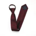 Detail view of a wine red zipper tie with slim red slash pattern, premium fabric texture. - Zipper Style / Burgundy Snowflake
