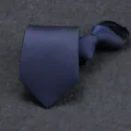 Close-up view of the dark blue textured zipper tie detail, ideal for professional business suits. - 8cm Sea Breeze Blue Zipper