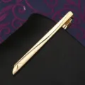 Golden metal tie clip detail, sleek streamlined design with delicate engraving for formal suit. - Tie Clip H (Gift Box)