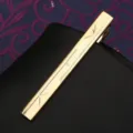 Gold metal tie clip featuring elegant engraved starburst details for men business suits. - Tie Clip K (Gift Box)