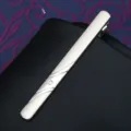 Close-up of a sleek silver metal tie clip featuring elegant curved lines and a small crystal detail. - Tie Clip J33 (Gift Box)