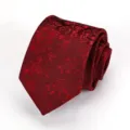 Burgundy floral jacquard tie detail shot showing rich texture and classic woven pattern close up - Dark Red