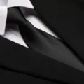 Close-up detail of a classic black formal business necktie paired with a crisp white shirt. - 8cm Black Irregular Zipper