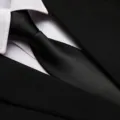 Close-up detail of black business necktie paired with white shirt collar and suit jacket. - 8cm Black Smooth Zipper