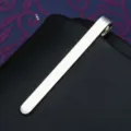 Close-up view of the minimalist silver brushed metal tie clip showing fine texture and sleek design. - Tie Clip JX002 (Gift Box)