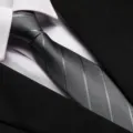 Detail view of men's classic black striped business tie, perfect for formal suits and weddings. - 8cm Light Gray Dark Stripe Zipper