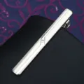 Close-up of a sleek silver metal tie clip featuring a sparkling crystal rhinestone detail. - Tie Clip LDJ1O7 (Gift Box)
