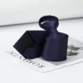 Detailed view of dark blue zipper tie, featuring delicate textured fabric for easy wear. - Navy Small Grid Zipper Style