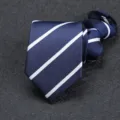 Close-up detail of a navy blue men's zipper necktie featuring classic white diagonal striped pattern. - 8cm Blue Stripe Zipper