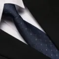 Detail view of a classic dark blue plaid patterned business necktie, perfect for formal wear. - 8cm A018 Zipper