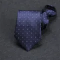 Close-up detail of dark blue men's business formal necktie with elegant geometric pattern design. - 8cm Fine Floral Houndstooth Zipper