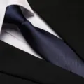 Detailed view of dark blue business necktie with fine twill texture and classic suit shirt. - 8cm Navy Smooth Zipper