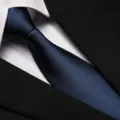 Close-up detail of a classic blue business necktie paired with white shirt and black suit. - 8cm Navy Blue Solid Zipper