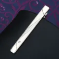 Silver metal tie clip detail showing diagonal textured pattern and embedded clear rhinestone. - Streamlined Tie Clip (Gift Box)