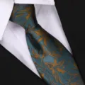 Detail shot of retro floral patterned necktie in dark green with gold leaf motifs for formal wear. - 8cm Zipper Style / Blue-Green Decorative Flower