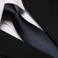 Detailed close-up of a stylish striped business tie with classic texture and elegant design. - 8cm Navy Fine Stripe Zipper