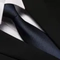 Close-up detail of blue and black striped business necktie with suit collar, elegant texture. - 8cm Sea Breeze Blue Zipper