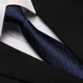 Detail shot of dark blue striped necktie showing fine texture, matching formal business attire. - 8cm Blue Bold Stripe Zipper