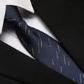 Close-up view of a navy blue business necktie featuring subtle stripe details paired with shirt. - 8cm Blue Meteor Zipper