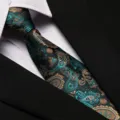 Detailed close-up of a stylish black paisley patterned necktie paired with a crisp white shirt. - 8cm Blue and White Porcelain Zipper