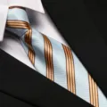 Close-up of a blue and gold striped business necktie with white shirt and black suit. - 8cm L018 Zipper