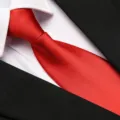 Classic red necktie paired with white shirt and black suit for formal business wear. - 8cm Bright Red Solid Zipper