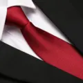 Classic red business tie with textured twill weave, paired with white shirt and black suit. - 8cm New Burgundy Fine Stripe Zipper