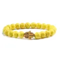 Bracelet de perles en turquoise jaune avec breloque main de hamsa en bronze pour yoga. - Main Dorée Turquoise Jaune
