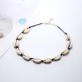 Handmade seashell choker necklace with black cord, adjustable lobster clasp, boho beach style. - Black Cord White Shell