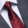 Close-up of a classic red necktie with white polka dots and elegant diagonal twill texture. - 8cm Festive Red White Dot Zipper